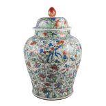 A large Chinese porcelain jar and cover, Kangxi, painted in famille verte enamels with three rows of