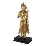 A large Sino-Tibetan gilt copper 'jewelled' figure of Padmapani Avalokiteshvara, standing, 17th/18th