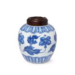 A Chinese porcelain jar, Kangxi, painted in underglaze blue to the body with a continuous leafy