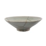 A Chinese celadon bowl, Song/Yuan dynasty, of conical form, with allover bluish/green glaze,