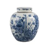 A Chinese porcelain jar and cover, 18th century, painted in underglaze blue with chrysanthemum and