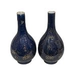 A pair of large Chinese porcelain powder-blue bottle vases, 18th century, gilt painted with cash