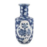 A large Chinese porcelain rouleau vase, Kangxi mark, 19th century, painted in underglaze blue with