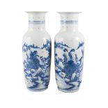 A large pair of Chinese porcelain baluster vases, 18th/19th century, painted in underglaze blue with