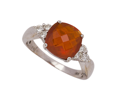 A fire opal and diamond ring, the cushion-shaped rose-cut fire opal in four claw mount to circular-