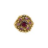 19th century ruby and synthetic ruby cluster ring, the central foiled oval cut ruby in collet mount,