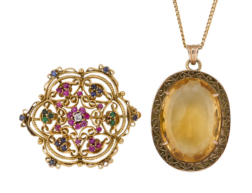 A citrine pendant necklace and gem brooch, the pendant with single oval mixed-cut citrine within