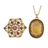 A citrine pendant necklace and gem brooch, the pendant with single oval mixed-cut citrine within