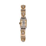 A lady's 1940s gold and diamond bracelet watch, the rectangular silvered dial with applied gilt