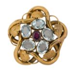 A 19th century gold aquamarine brooch, of entwined stylised grape vine design, with four collet-