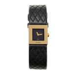 An 18ct gold wristwatch 'Matelasse' quartz wristwatch, by Chanel, the square striated black dial