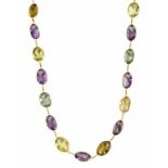 An amethyst, aquamarine and citrine necklace, composed of a row of spectacle-set alternate oval-