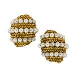 A pair of cultured pearl earclips, each of barrel shape with wire-work bands and triple row of