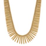 An 18ct gold flexible fringe necklace, composed of series of alternate textured and polished