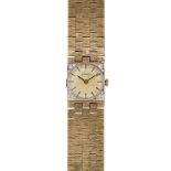 A lady's 9ct.gold and diamond bracelet watch, by Longines, the circular gilt textured dial with