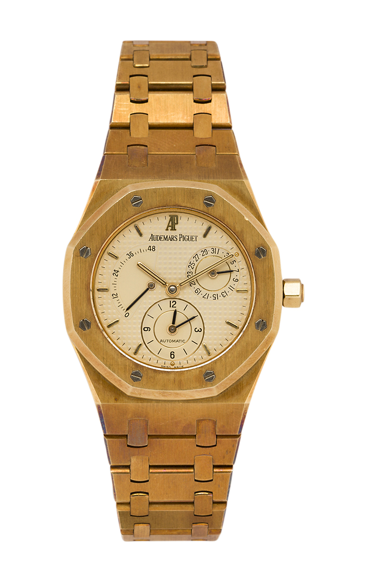 An 18ct gold 'Royal Oak' dual time automatic wristwatch by Audemars Piguet, ref. 25730BA , the cream