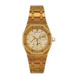 An 18ct gold 'Royal Oak' dual time automatic wristwatch by Audemars Piguet, ref. 25730BA , the cream