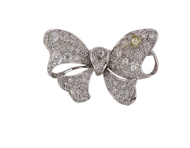 A diamond bow brooch, the ribbon bow with pave old-brilliant-cut diamonds and diamond two stone