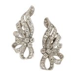 A pair of diamond earrings, each of circular-cut diamond ribbon spray design with baguette diamond