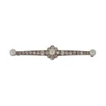 A Belle Epoque diamond and pearl bar brooch, the central pearl and old-brilliant-cut diamond cluster