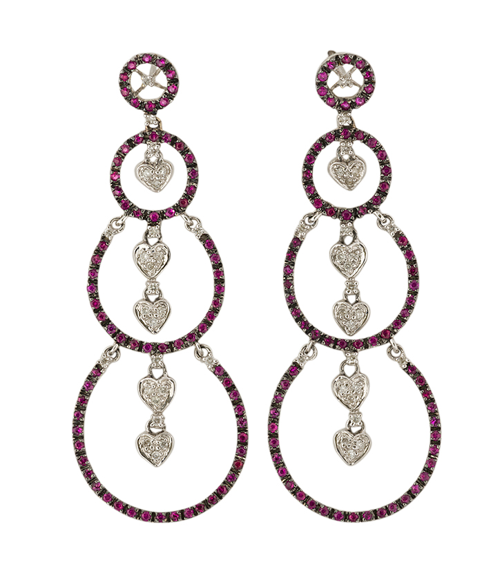 A pair or diamond and ruby drop earrings, each composed of three graduated openwork hoops each