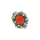 An 18ct gold coral diamond and gem cluster ring, the central cabochon coral, corallium rubrum,