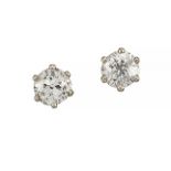 A pair of diamond single stone ear studs, each old-mine brilliant-cut diamond weighing approximately