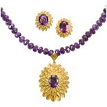 A suite of amethyst jewellery, comprising: a faceted amethyst bead necklace suspending an oval