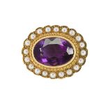 An Edwardian gold and half-pearl brooch, the collet-set oval mixed-cut amethyst in gold mount with