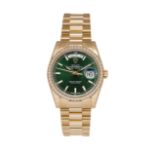 An 18ct gold, diamond-set, Day-Date automatic wristwatch, by Rolex, Ref. 118348, the emerald green