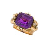 An amethyst and diamond ring, the central rectangular-cut amethyst with single-cut diamond single