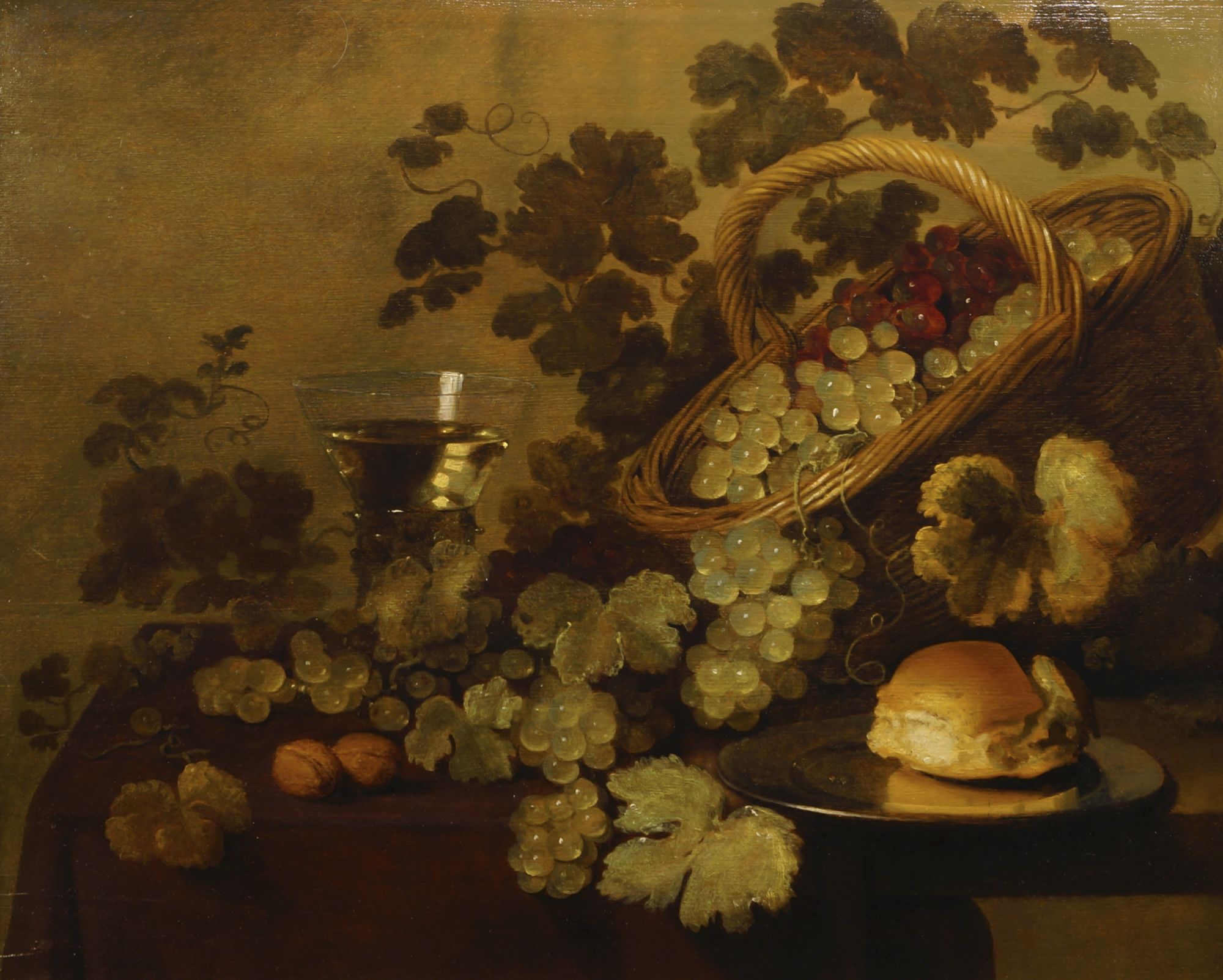 Follower of Simon Pieter Verelst, Flemish 1644-1741- Still life with grapes, walnuts, a bun on a