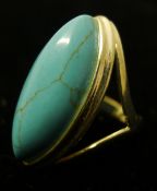 A silver and turquoise ring