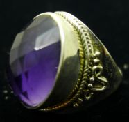 A silver and amethyst ring