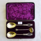 A boxed set of EPNS strawberry servers and a sugar sifter spoon