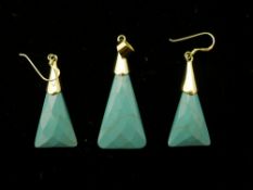 A pair of turquoise earrings,