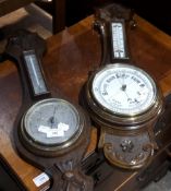 An oak framed barometer and another
