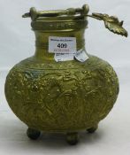 A Tibetan brass vessel and ladle