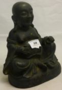 A bronze model of Buddha