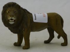 A cold painted bronze model of a lion