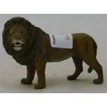 A cold painted bronze model of a lion