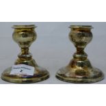 A pair of silver candlesticks