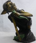 A bronze model of a pixie