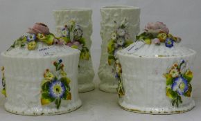 A pair of Victorian flower encrusted pots and covers and a pair of vases en-suite