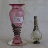 A silver mounted cranberry glass vase and a scent bottle