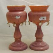 A pair of Victorian pink glass lustres