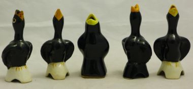 A collection of ceramic blackbird pie funnels