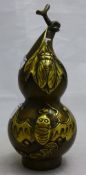 A bronze double gourd ornament