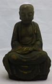 A Chinese carved wooden model of Buddha