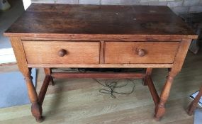 An early 20th century oak two drawer side table